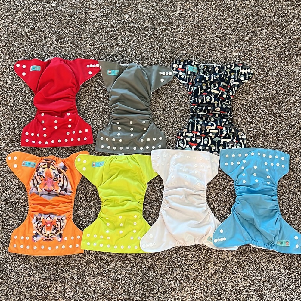 14 Alva Baby Cloth Diapers, Inserts, and waterproof Laundry Bag.